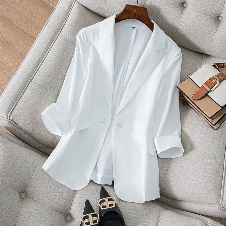 Professional women's Ava blazer styled with slacks, ideal for office wear. Tailored jacket offering a chic, modern look.