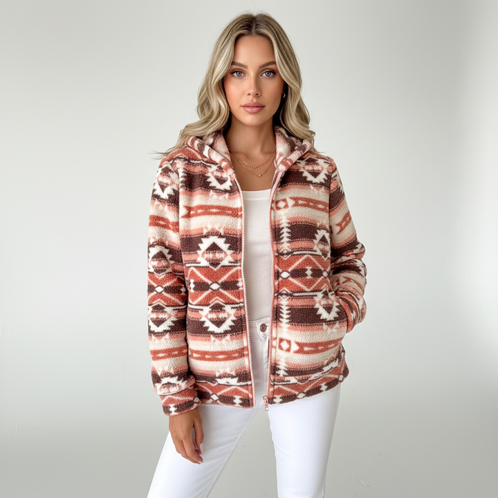 Close-up of a women's teddy fleece vest with intricate Aztec pattern, perfect layered outerwear