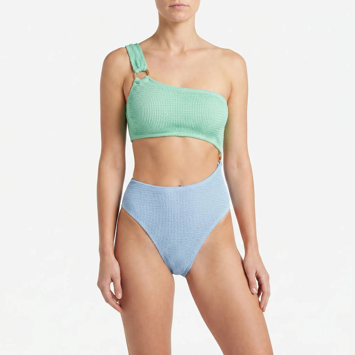 Stylish one-piece asymmetric swimsuit for women, features modern cut-outs. Ideal for vacation and beach.