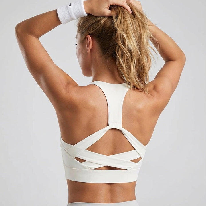 Athletic women's sports top, backless design with lacing, breathable gym wear pro-level fit.