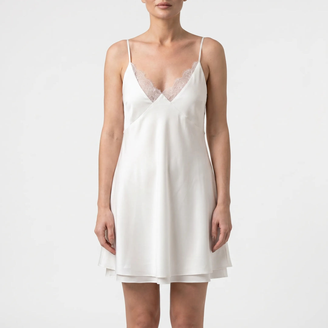Sleeveless A-line white mini dress for women, ideal for casual summer evenings & party wear.