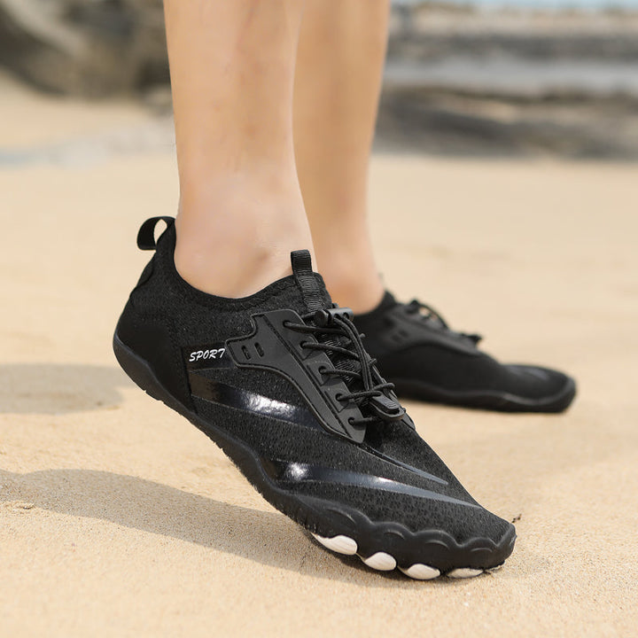 Side view of women's minimalist sport shoes, showcasing lightweight, breathable construction.