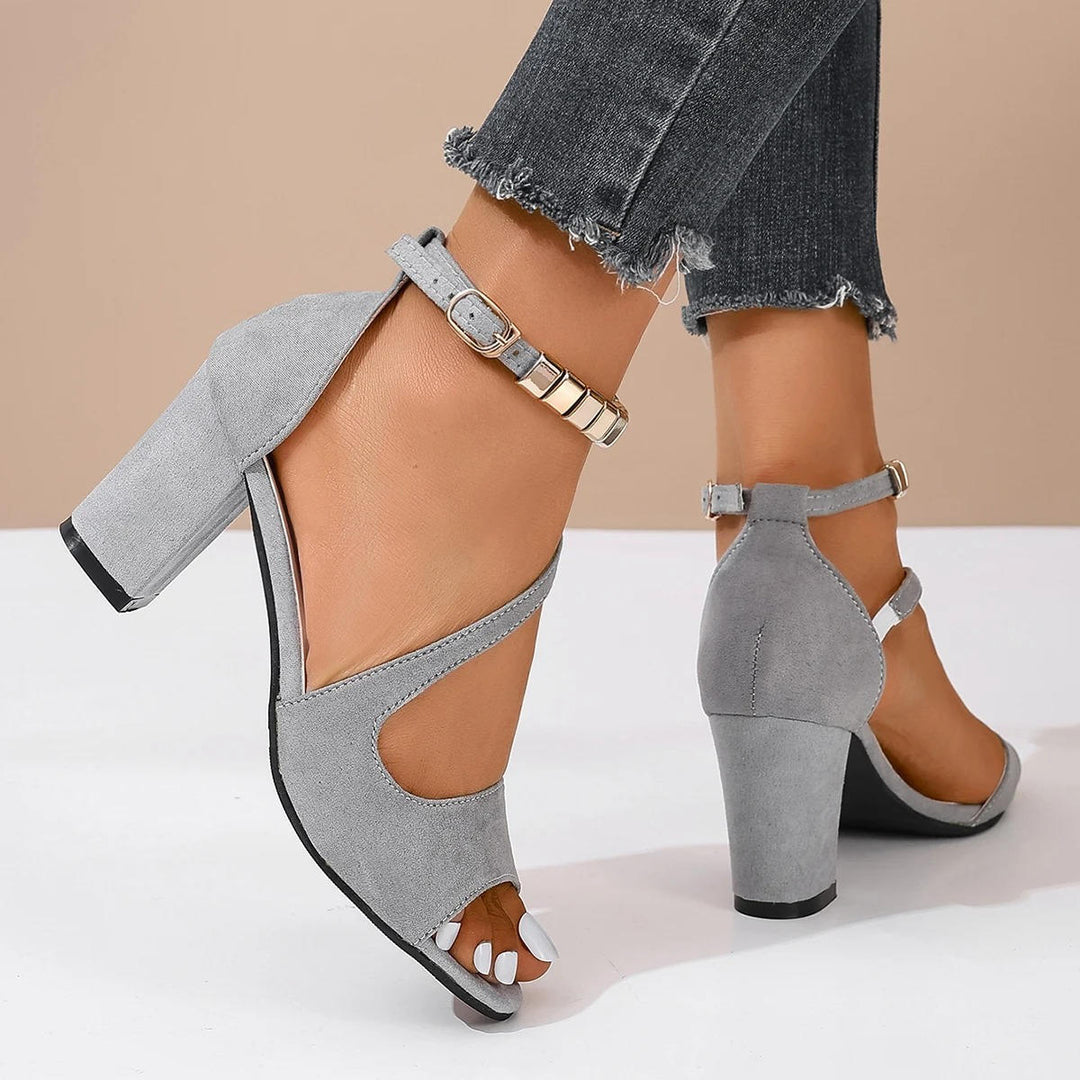 Women's sandals with stunning beaded ankle strap, open toe design, and supportive block heel for comfort.