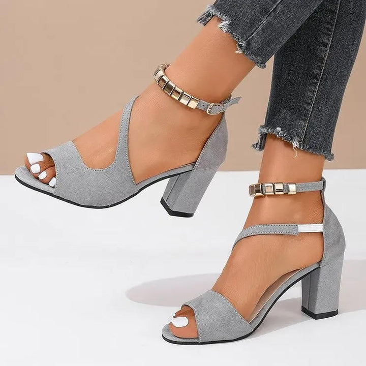 Women's fashionable open toe block heel sandals with a decorative beaded ankle strap, ideal for summer.
