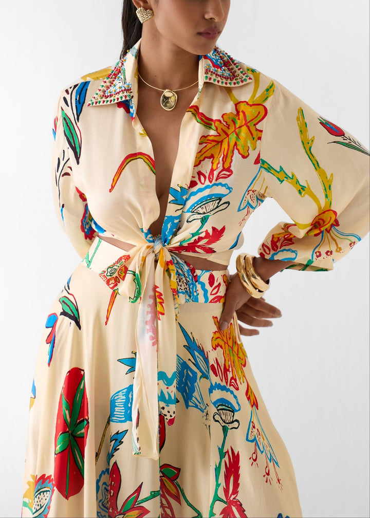 Stylish beige floral print matching set, a two-piece tie front shirt and maxi skirt for vacation outfits.