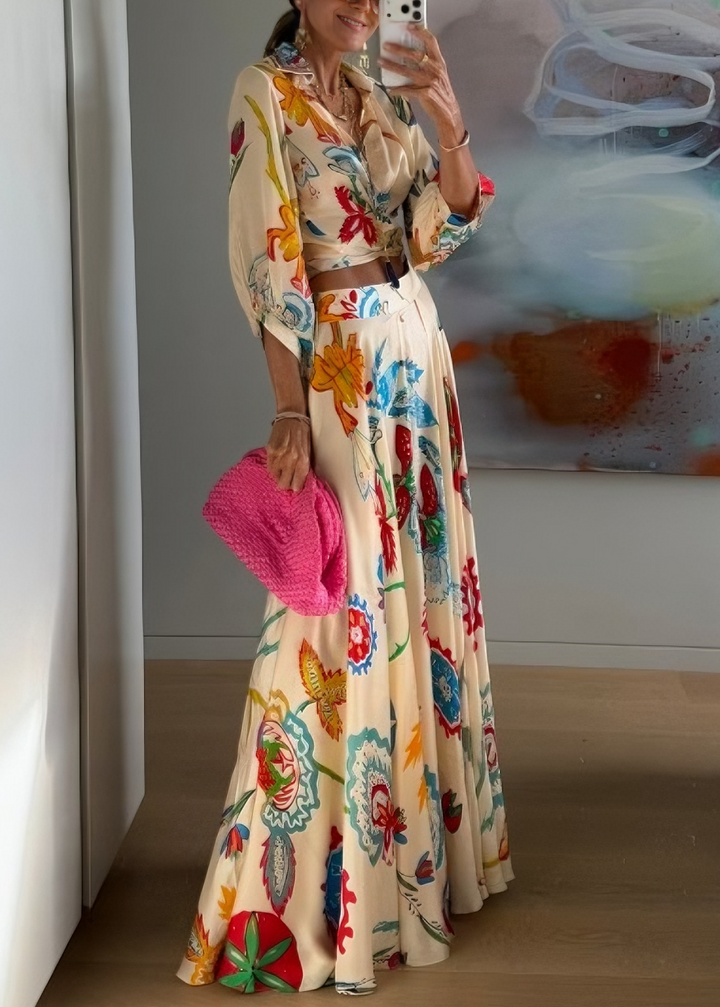 Women's beige floral print resort wear set: a tie front blouse & elegant maxi skirt, perfect for travel.