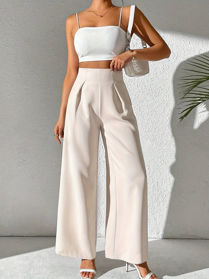 Comfortable women's beige high-waist wide-leg trousers, ideal for stylish summer outfits.