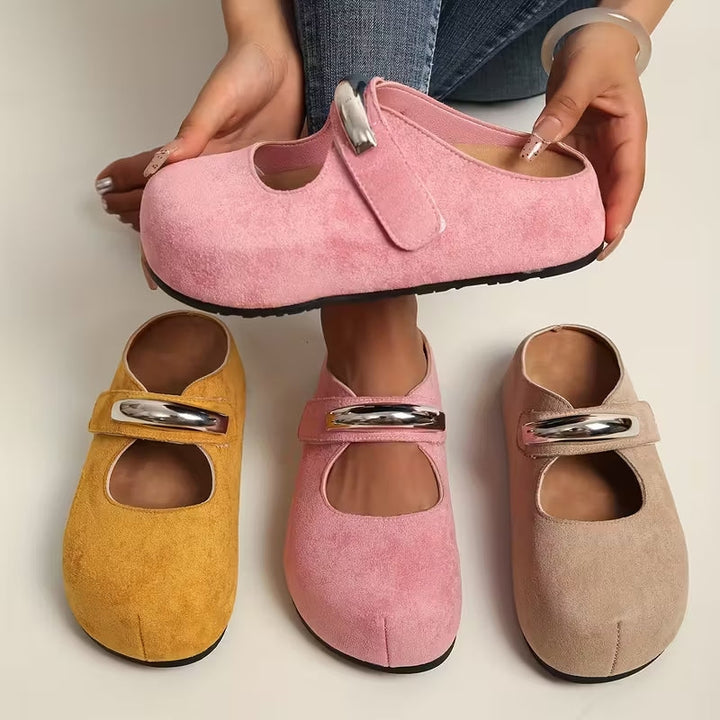 Women's beige suede slip-on shoes, comfortable and stylish flats for everyday wear.