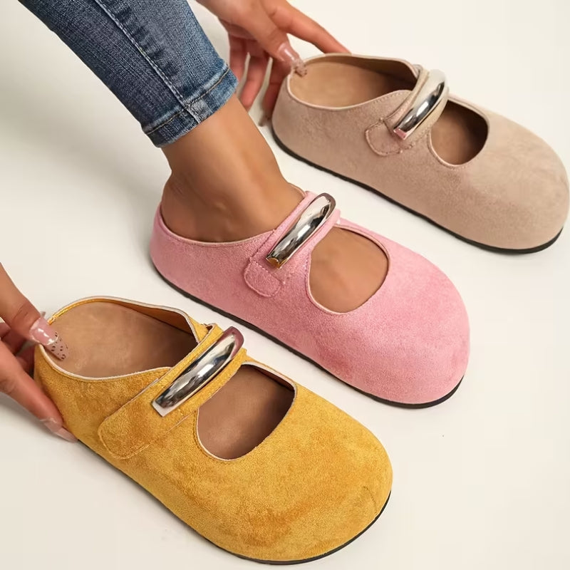Elegant pink suede slip-on flats for women, offering versatile style and comfort.