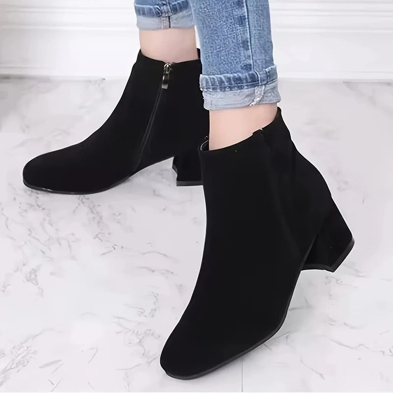 Comfortable women's ankle boots with a chic block heel & practical side zip for versatile everyday wear.