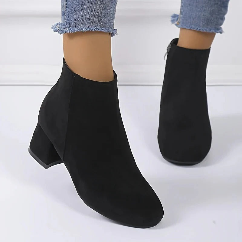 Versatile women's ankle boots, sturdy block heel, and functional side zip, designed for easy wear & comfort.