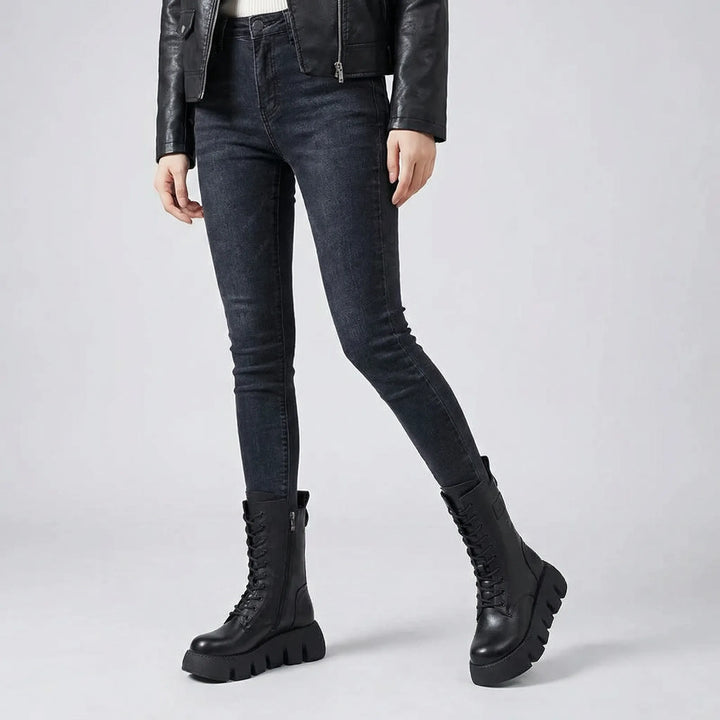 Durable women's platform combat boots featuring lace-up closure and arch support for all-day comfort.