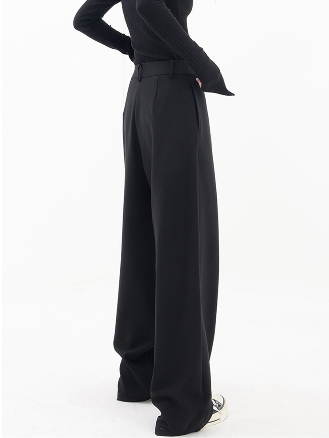 Stylish black women's baggy trousers with an asymmetric hem and comfortable, relaxed wide leg fit.