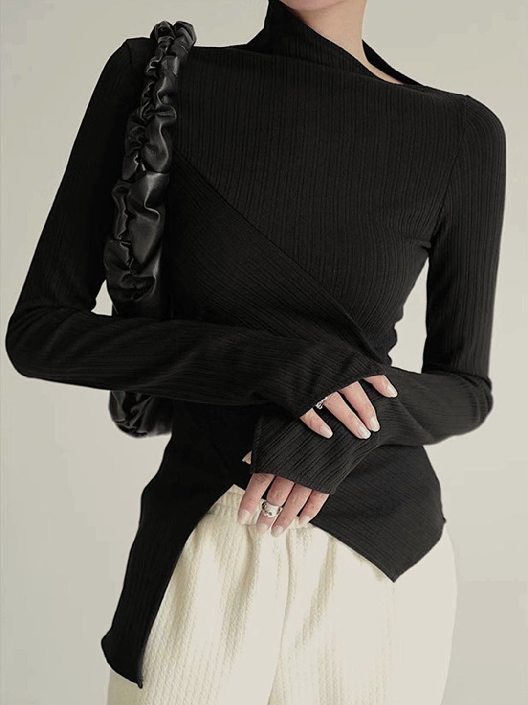 Women's black asymmetrical cutout jumper, long sleeve, cotton blend for stylish comfort.