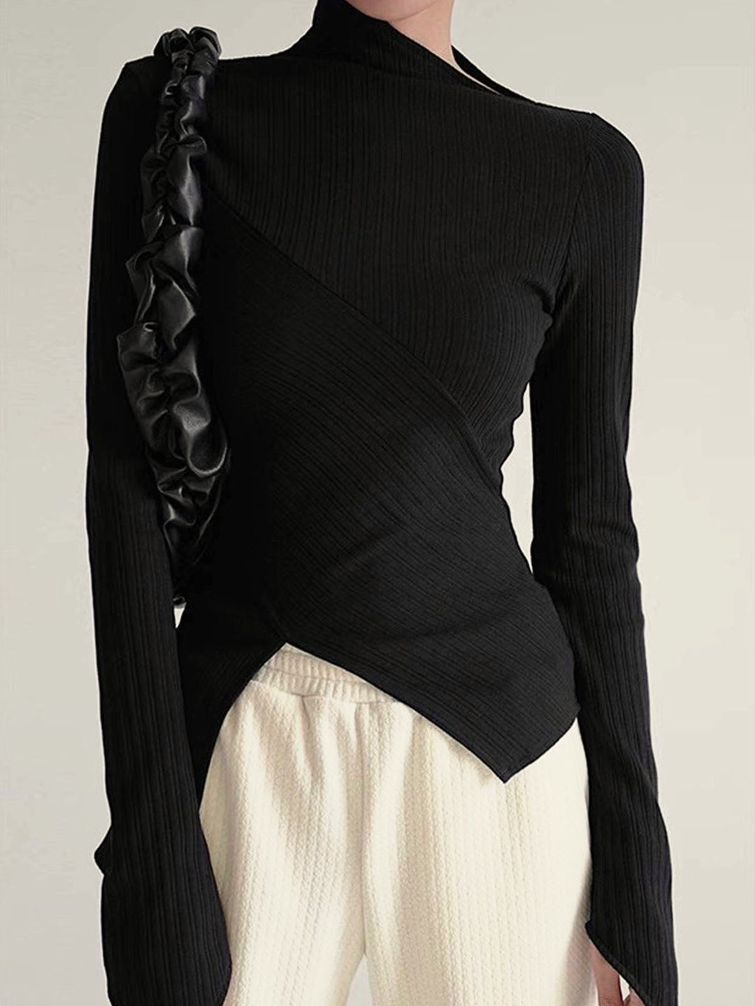 Comfortable women's cotton blend asymmetrical black jumper, long sleeve with chic cutout detail.