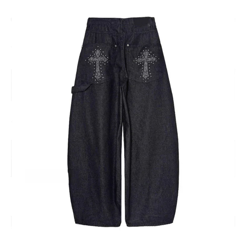 Stylish women's wide-leg baggy pants with a distinctive studded cross, embracing streetwear & punk aesthetics.