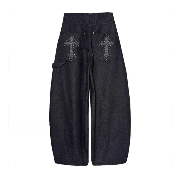 Stylish women's wide-leg baggy pants with a distinctive studded cross, embracing streetwear & punk aesthetics.