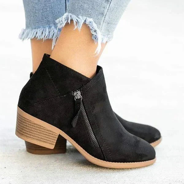 Comfortable women's casual boots with a sturdy block heel, ideal for everyday wear. Easy side zip ankle boot design.