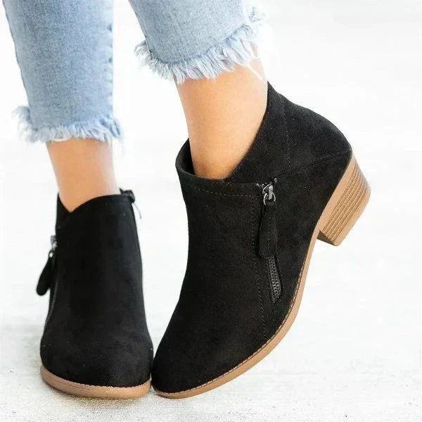 Elegant women's pointed toe ankle boots with a supportive block heel and functional side zip for easy wear. Winter style.