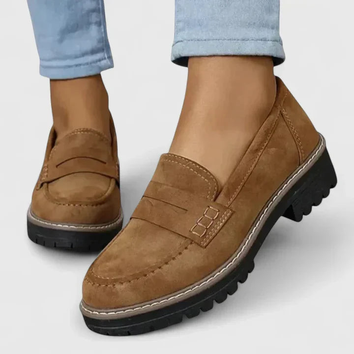 Chunky lug-sole women's penny loafers. Easy slip-on platform shoes, perfect for casual outfits & versatile style.