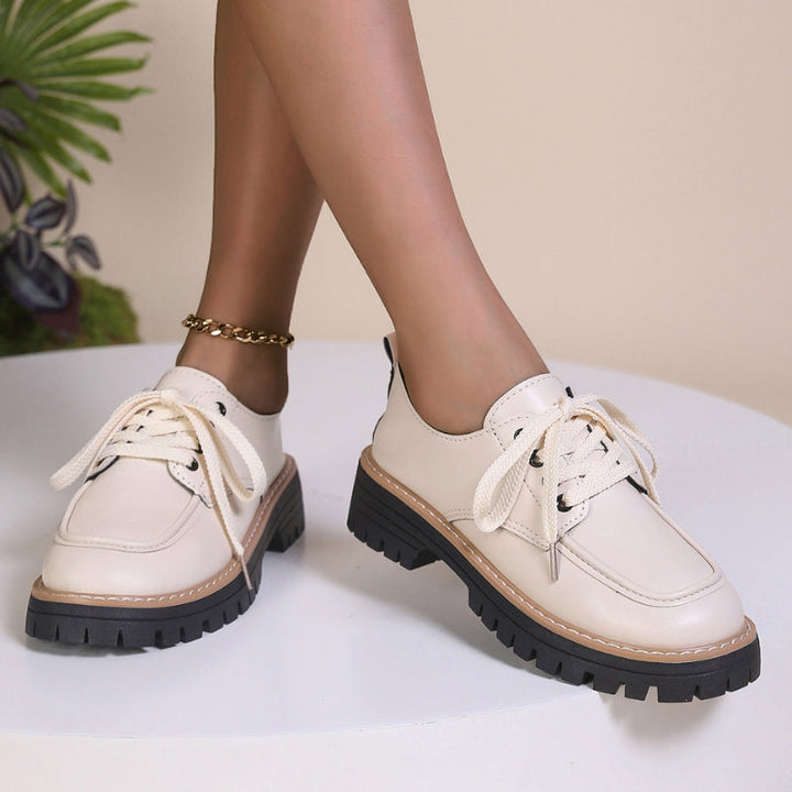 Comfortable women's cream chunky platform loafers, perfect for stylish everyday wear or special occasions.