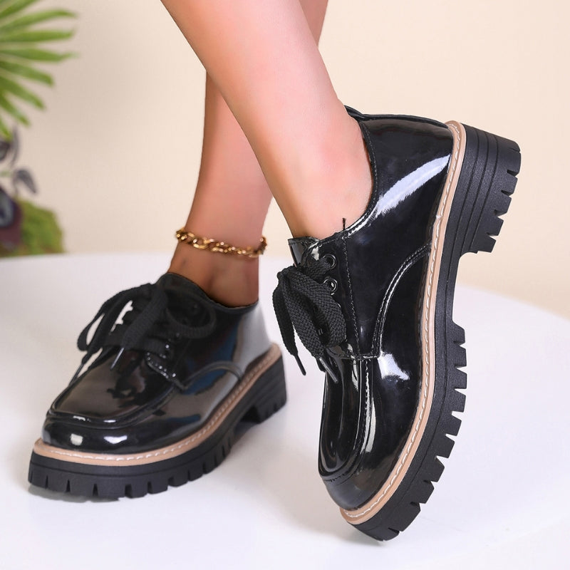 Durable women's red chunky platform loafers, offering style and stability for all-day comfort.