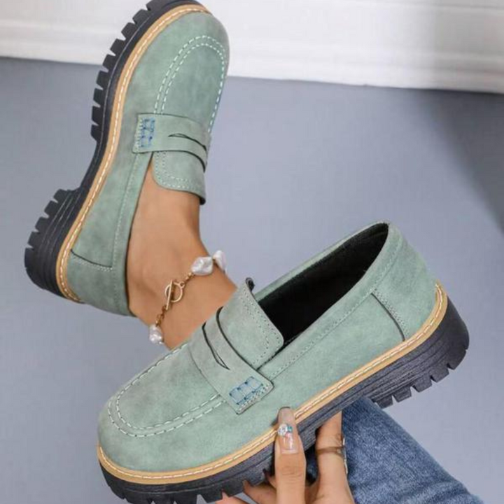 Comfortable women's slip-on chunky platform loafers featuring a chic round toe and durable sole.