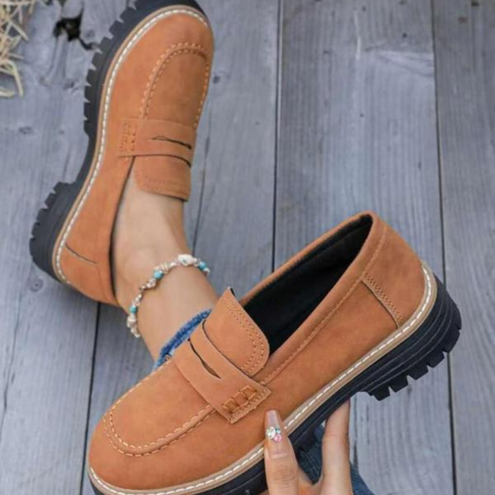 Black women's chunky platform loafers for an elevated, stylish and modern look. Easy slip-on design.