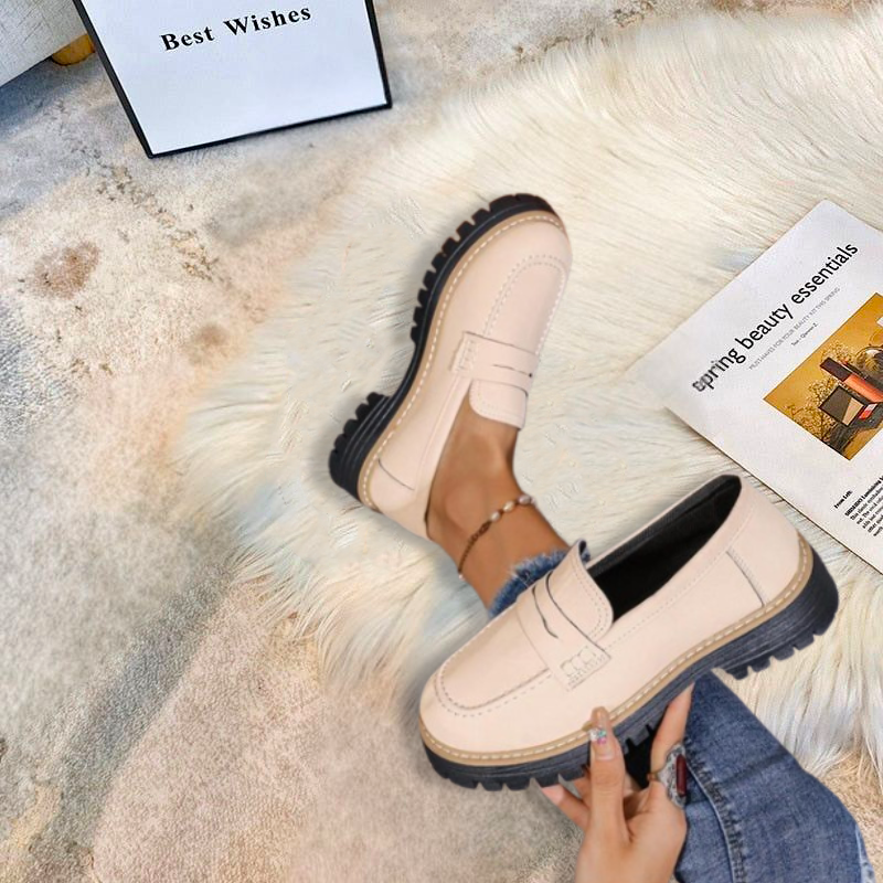 Modern women's chunky platform loafers. Comfortable slip-on design with a stylish round toe. Versatile footwear.