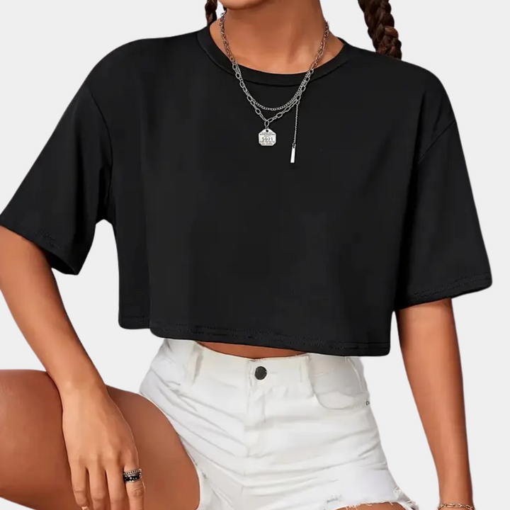 Women's black cropped t-shirt with a colorful butterfly design, perfect for trendy summer casual wear.