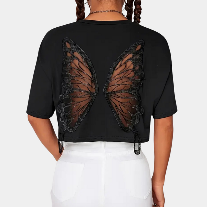 Comfortable black women's cropped top featuring a stylish butterfly print, ideal for everyday playful summer fashion.