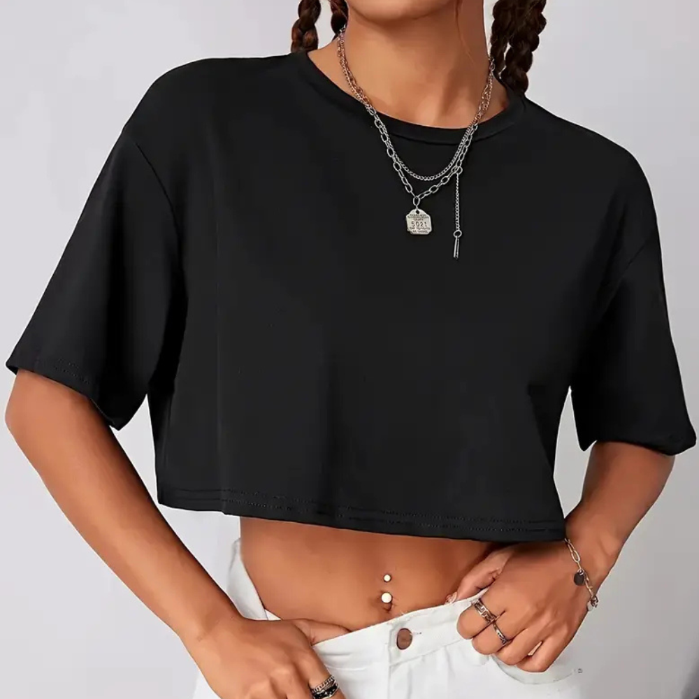 Trendy black short-sleeve cropped t-shirt for women, detailed with a vibrant butterfly, great for casual summer outfits.