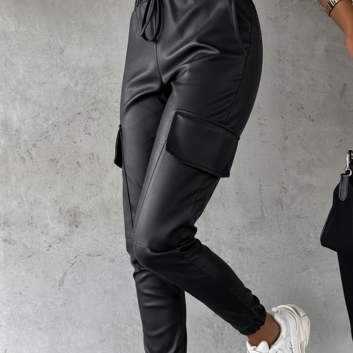 Stylish women's black cargo pants with an elastic waist, offering a comfort fit and versatile casual wear.