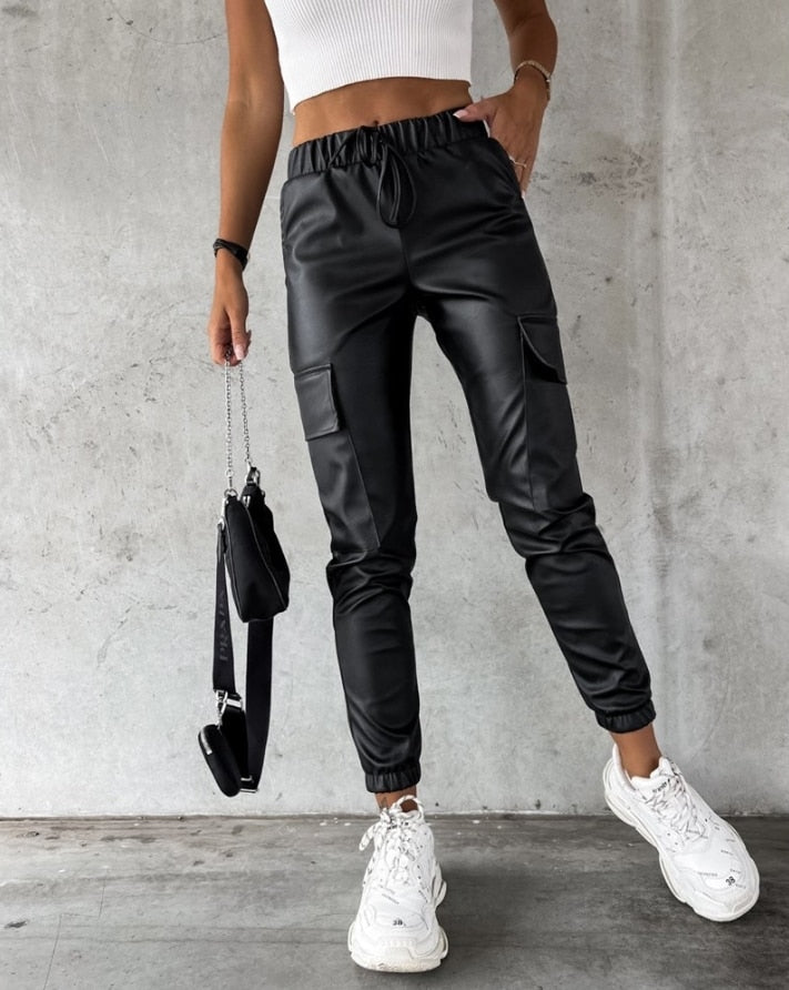 Faux leather black cargo pants for women with an elastic waist, perfect for autumn fashion and stylish comfort.
