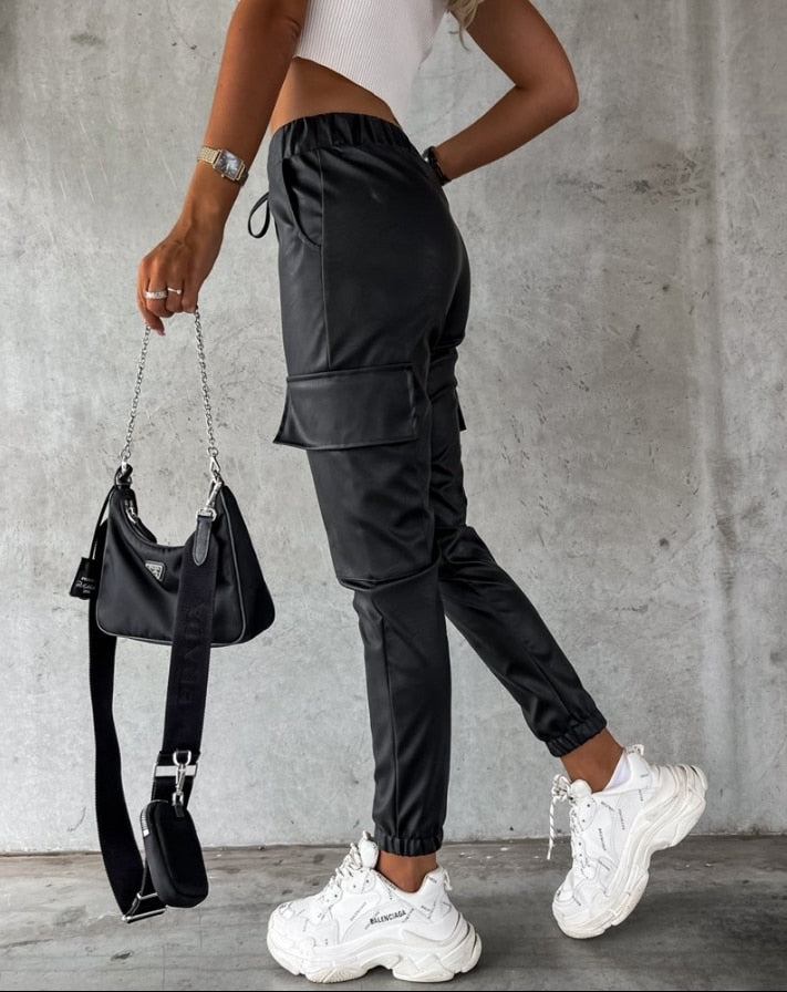 Versatile black women's cargo trousers with elastic waistband, providing a stylish and comfortable casual wear option.
