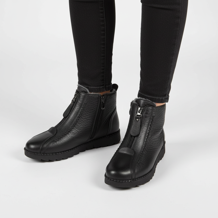 Durable women's zip-up ankle boots, fleece-lined, offering warmth and style for winter outfits