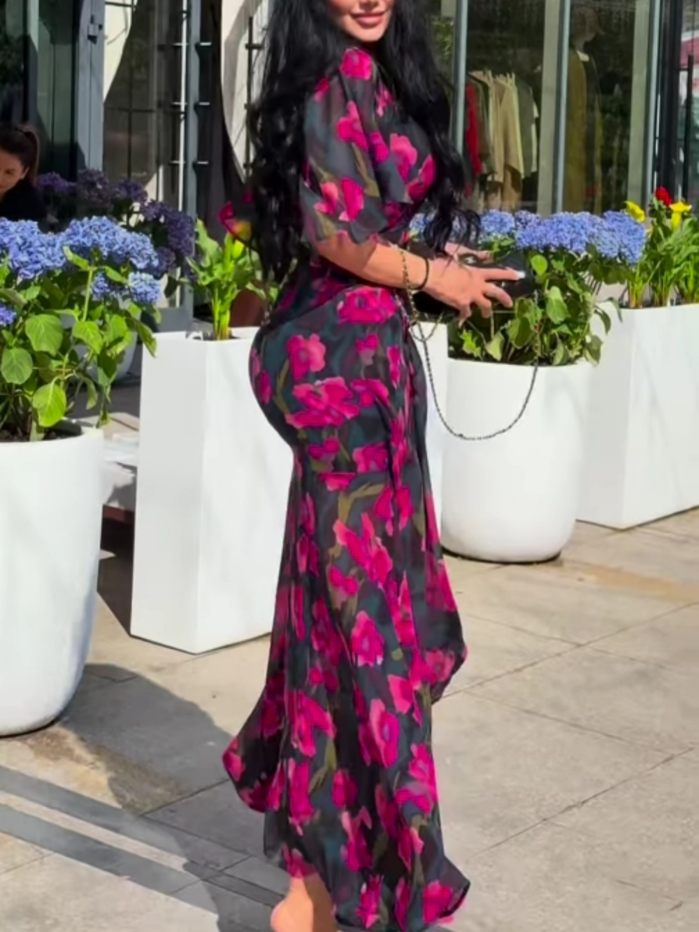 Black floral print women's maxi dress with V-neck, trumpet sleeves & belted waist. Versatile summer/party dress.