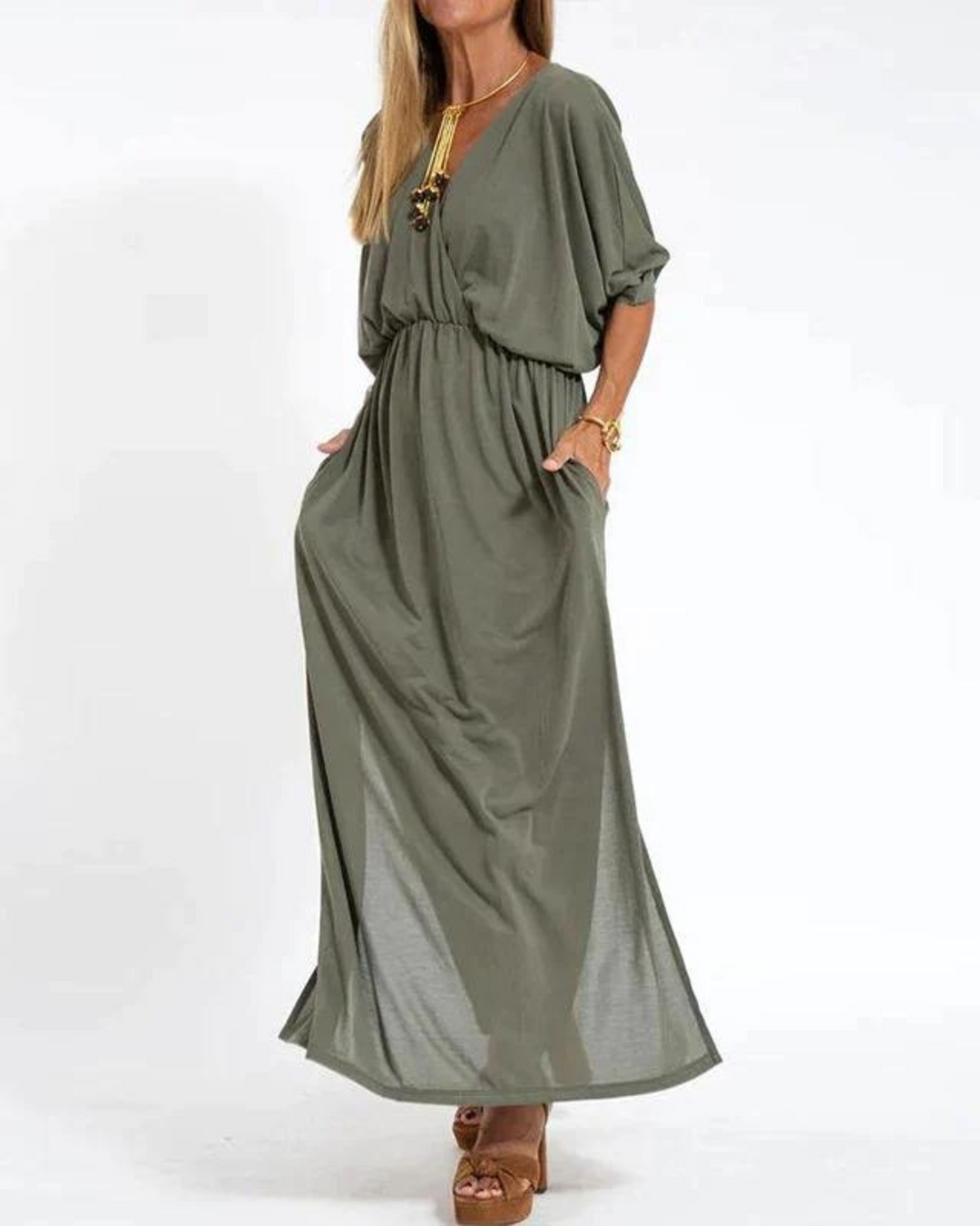 Women's black flowy midi dress with adjustable straps. Perfect comfortable summer casual or elegant attire.
