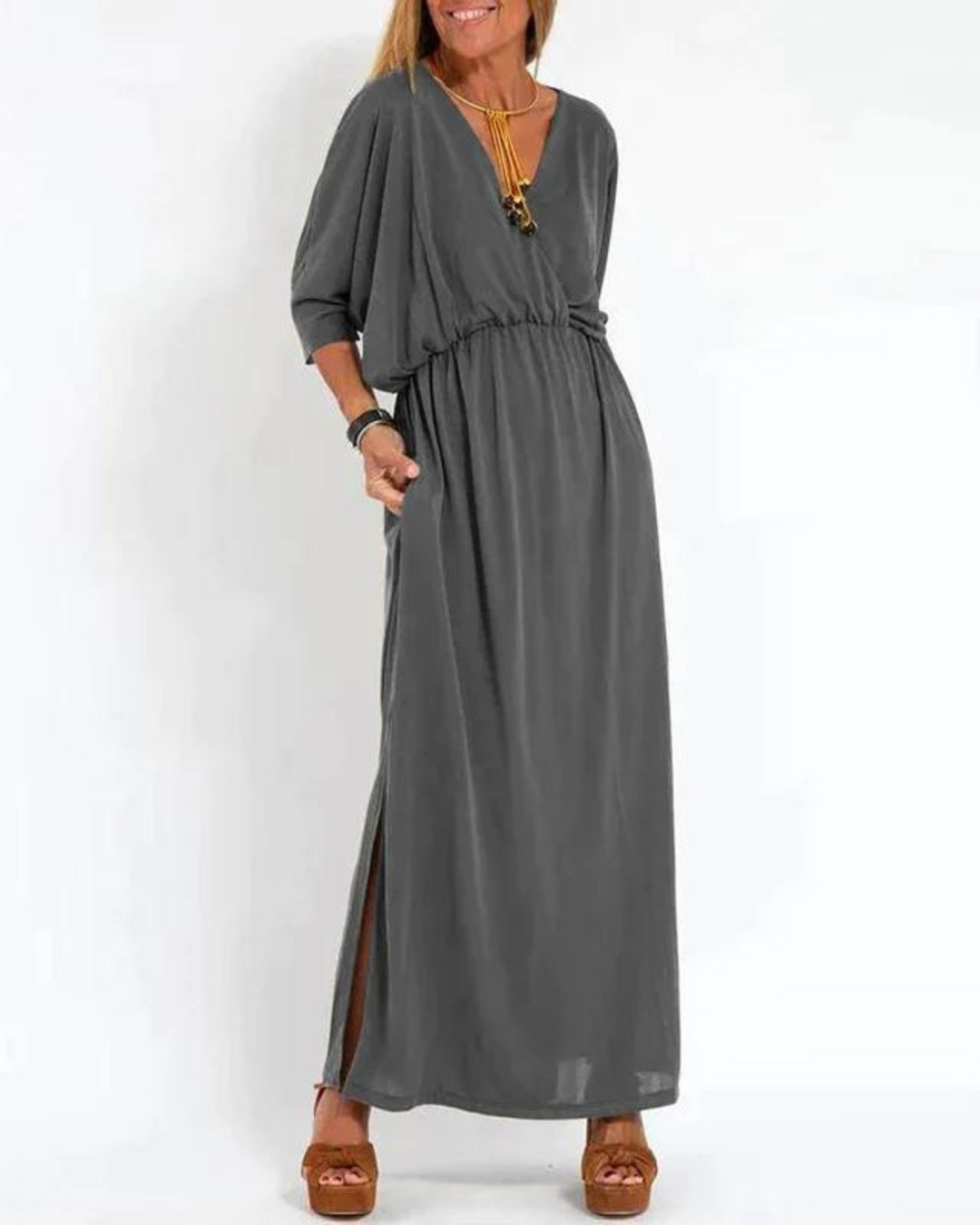 White flowy midi dress for women, featuring adjustable straps. Ideal comfortable summer vacation & casual wear.