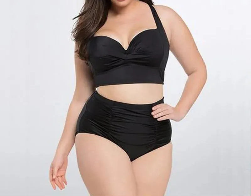 Stylish women's black halter bikini top with high waist bottoms. Padded swimwear, ideal for beach and pool.