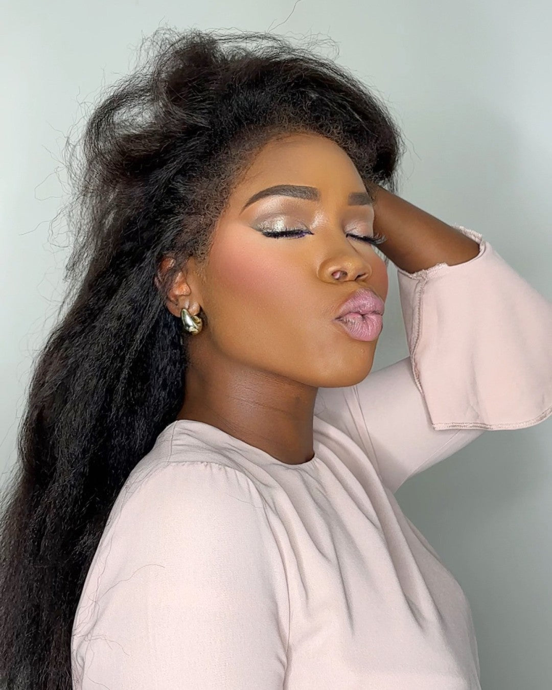 Black HD lace wig for women, featuring natural curly edges, full density human hair, and comfortable wear.
