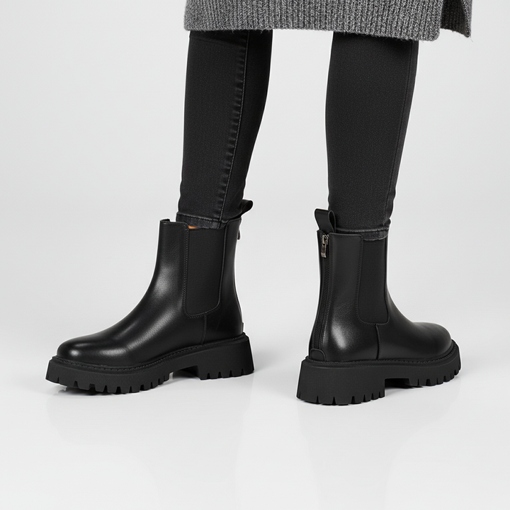 Carolyn black round toe Chelsea ankle boots for women, featuring a comfortable design and back zip.