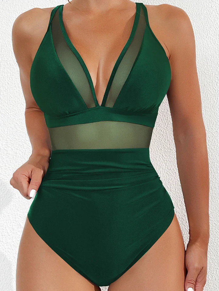 Elegant women's swimsuit 'Chiara' with mesh details and push-up effect, ideal for pool or beach.