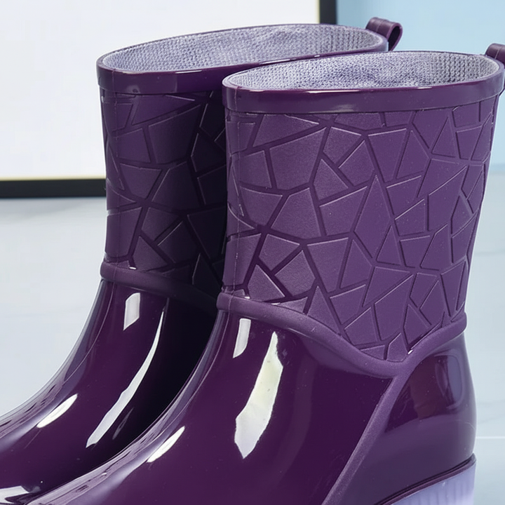 Pair of women's waterproof mid-calf boots for rain, designed for comfort and traction