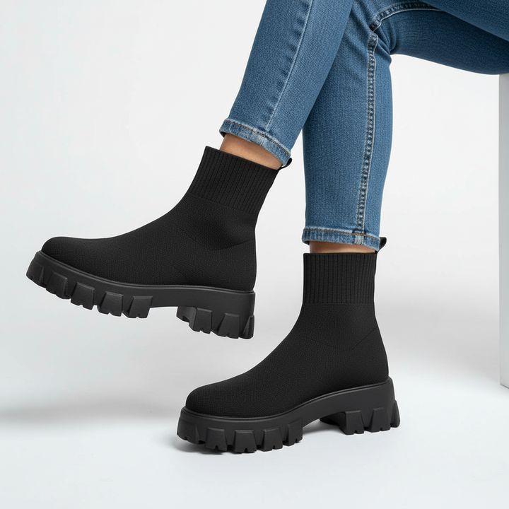 Close-up of black women's platform boots showcasing the modern design and quality material.