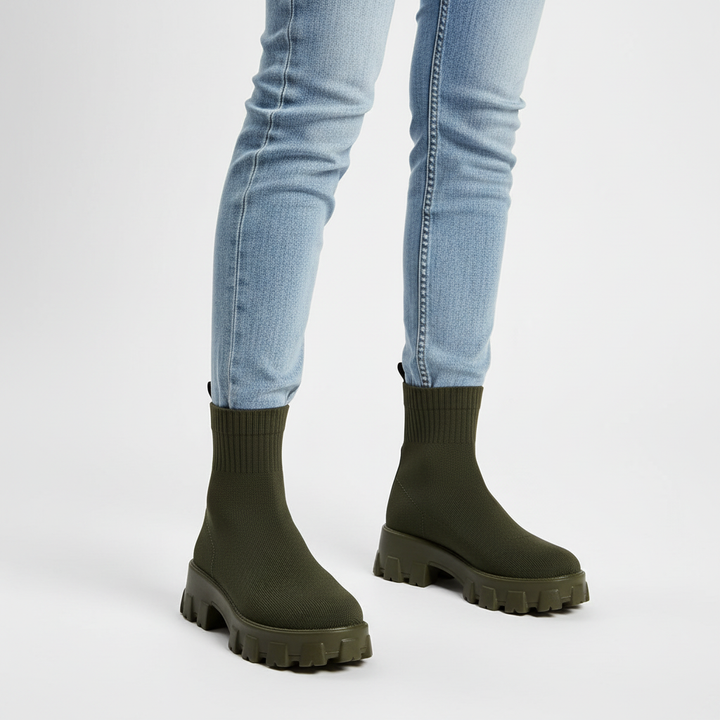 Pair of women's black platform ankle boots, a versatile and trendy footwear option.