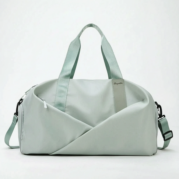 Organized women's black duffel bag for gym & travel, showcasing its separate shoe compartment and spacious interior.
