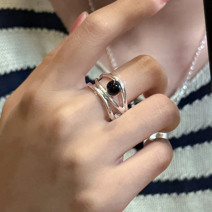 Statement black onyx multi-line sterling silver ring for women, fashionable gemstone jewelry.