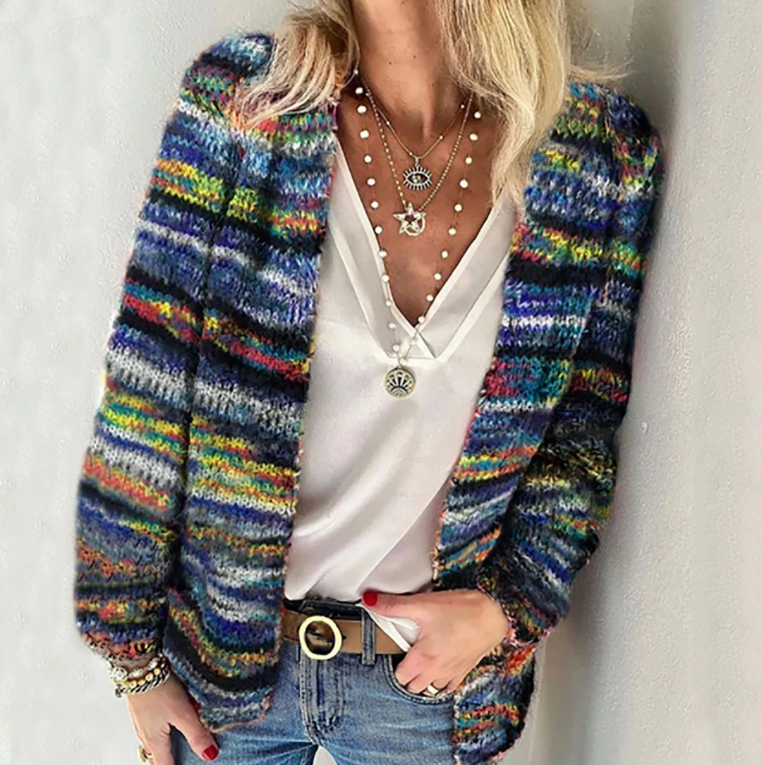 Cream women's open front cardigan. Versatile relaxed fit long sleeve sweater, ideal for winter outfits and comfortable layering.