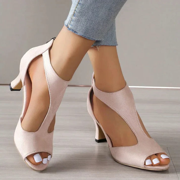 Elegant pink women's orthopedic high heels, blending fashion & comfort for formal occasions. With foot support.